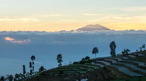 Scenic view of mountains against sky during sunset