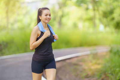 Young woman exercising in park