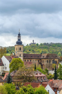 Buildings in city against sky