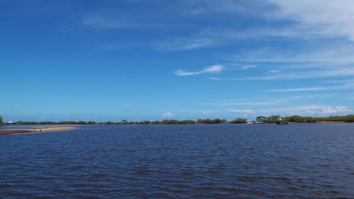 Scenic view of sea against blue sky