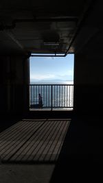 View of sea seen through window