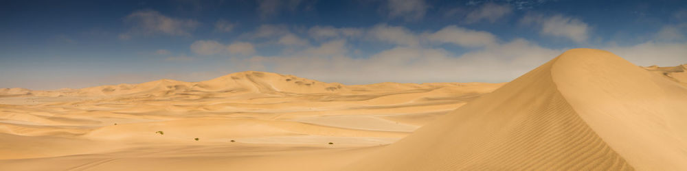 Panoramic view of desert against sky