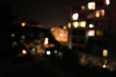 Defocused image of illuminated city at night