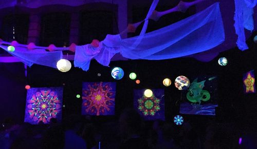 Close-up of illuminated lanterns hanging at night