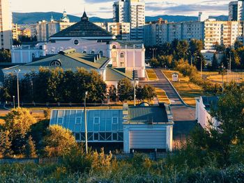 High angle view of trees and buildings in city