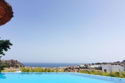 Scenic view of sea against clear blue sky