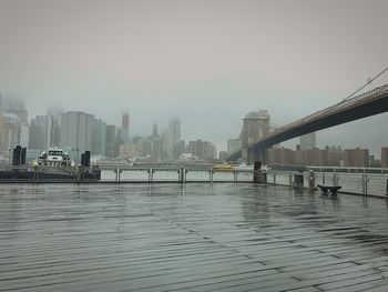 View of suspension bridge with city in background