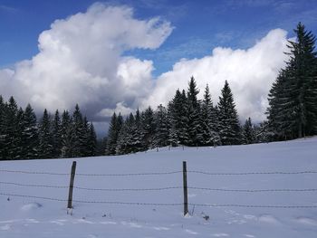 Scenic view of snow covered mountains against sky