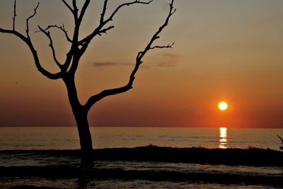 Scenic view of sea against sky at sunset