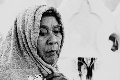 Close-up of senior man covering head with towel