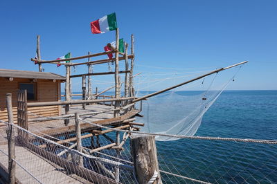 Lifeguard hut against clear blue sky