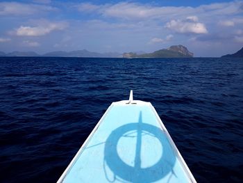 Close-up of boat in sea against sky