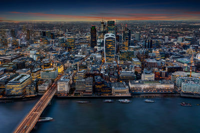 High angle view of illuminated buildings in city