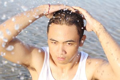 Man splashing water in sea