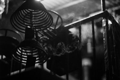 Close-up of clothes hanging on glass at night