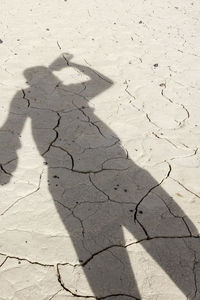 High angle view of shadow on sand