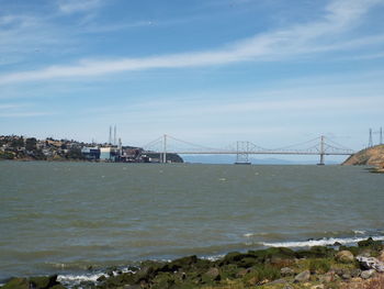 View of suspension bridge over sea