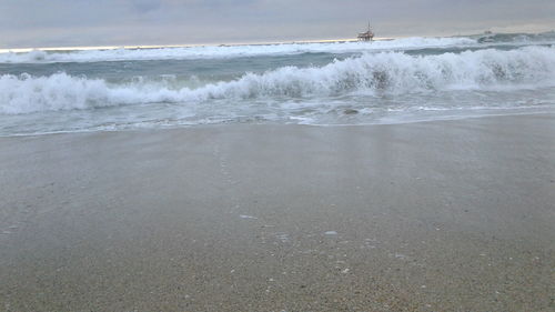 Scenic view of beach against sky