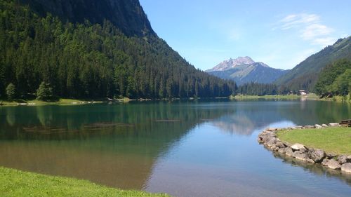 Scenic view of lake with mountains in background