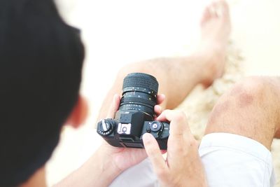 Close-up of man holding camera