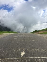 Road by landscape against sky