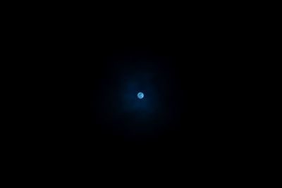 Scenic view of moon against clear blue sky at night