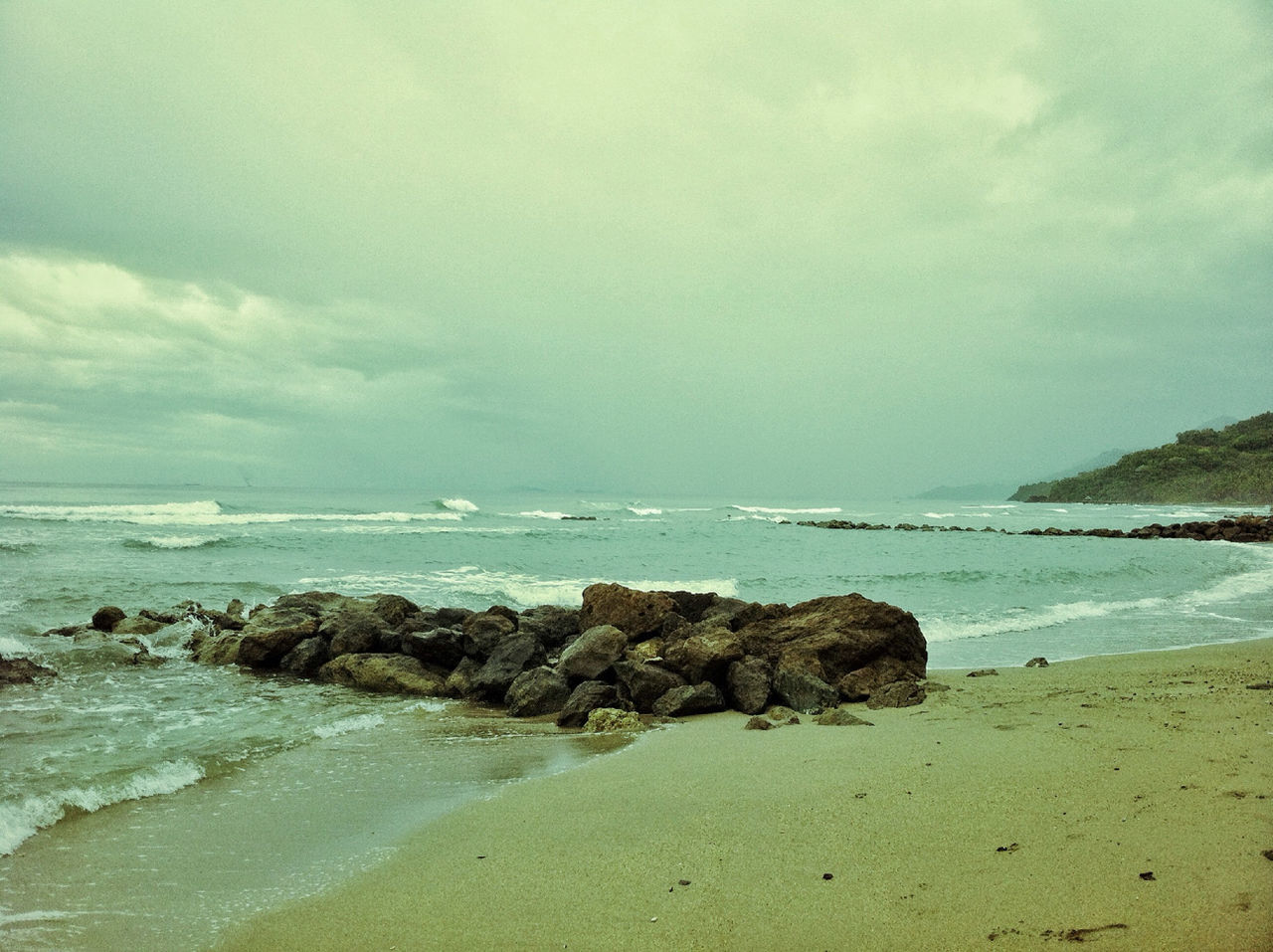 sea, water, beach, horizon over water, sky, shore, tranquil scene, scenics, tranquility, beauty in nature, cloud - sky, nature, rock - object, sand, wave, coastline, cloudy, idyllic, cloud, surf