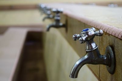 Close-up of faucet in water