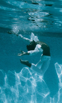 Dancer swimming in pool