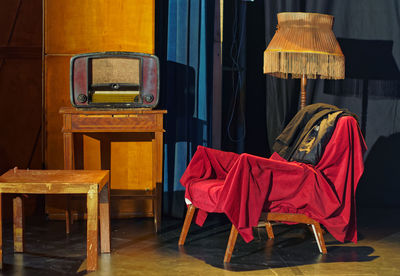 Vintage radio on table with furniture at home