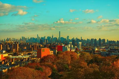 Cityscape against cloudy sky