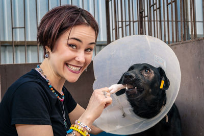 Dog at the shelter. animal shelter volunteer takes care of dogs. 