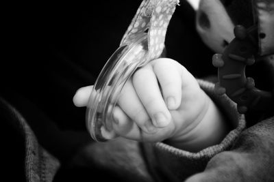 Close-up of hands holding baby