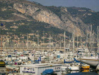 Boats moored at harbor