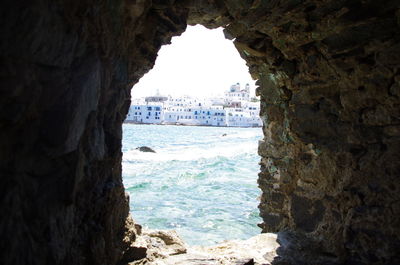 View of sea seen through cave