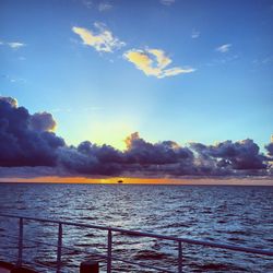 Scenic view of calm sea against blue sky
