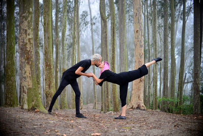 Couple kissing in forest