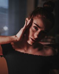 Portrait of beautiful young woman at home