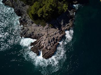 High angle view of rock formation in sea