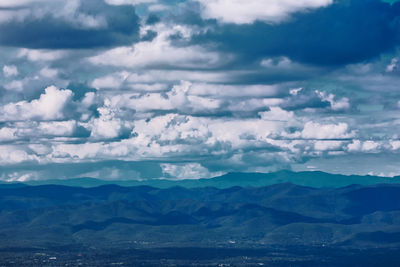 Aerial view of landscape against dramatic sky