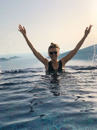 Young man swimming in sea