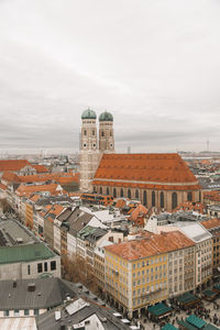 High angle view of buildings in city against sky