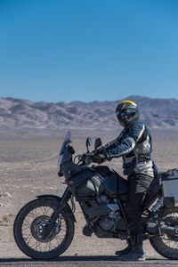Man on touring motorbike in the atacama desert
