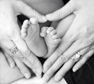 Close-up of hand holding baby