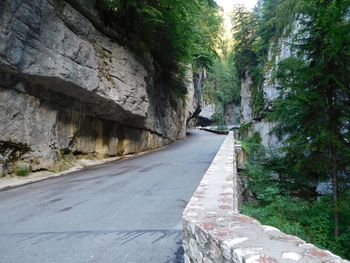Empty road along rocky wilderness area