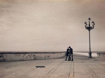 Man on beach against sky