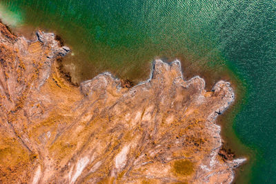 High angle view of rocks in sea