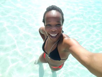 Portrait of a smiling girl in swimming pool