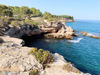 Scenic view of sea against clear sky