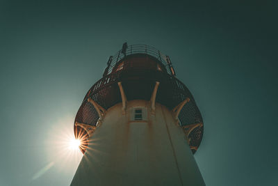 Low angle view of illuminated tower against clear sky